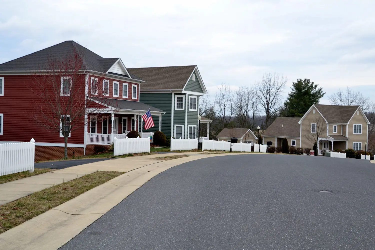 Row of large suburban houses along a street.