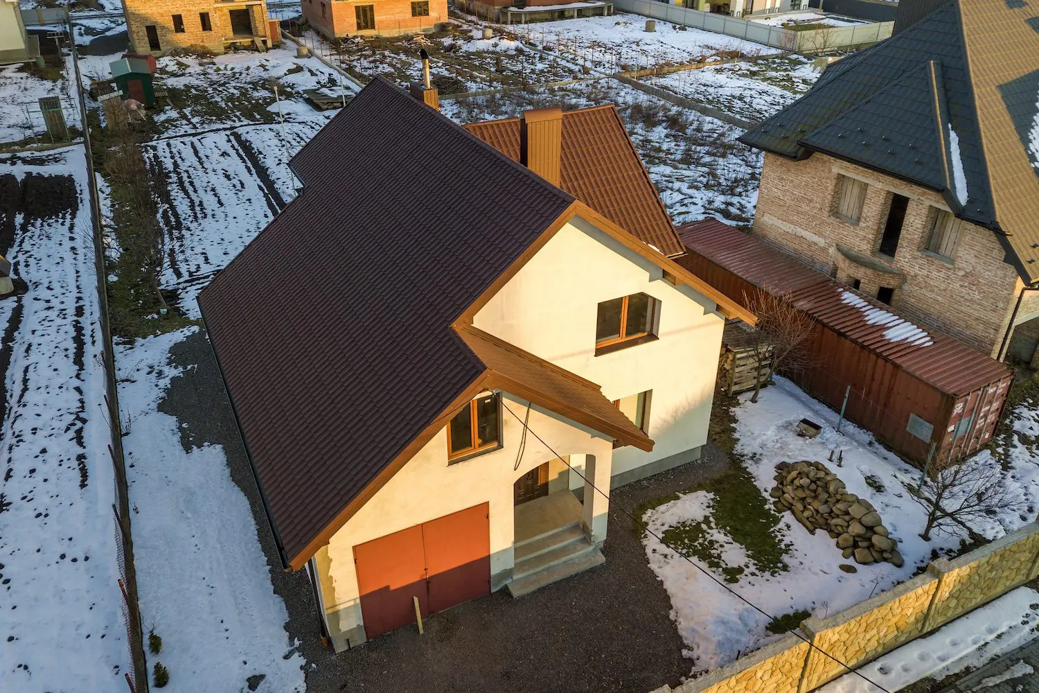 Aerial view of new residential house cottage and attached garage
